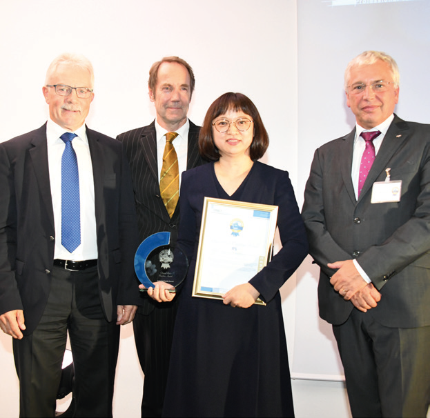 Best Overall Best Practices Award Industrial Textile Services: Nantong Fornet & Ycloset Ltd. (China). The trophy was awarded by Mr. Charles Betteridge from Christeyns (left)