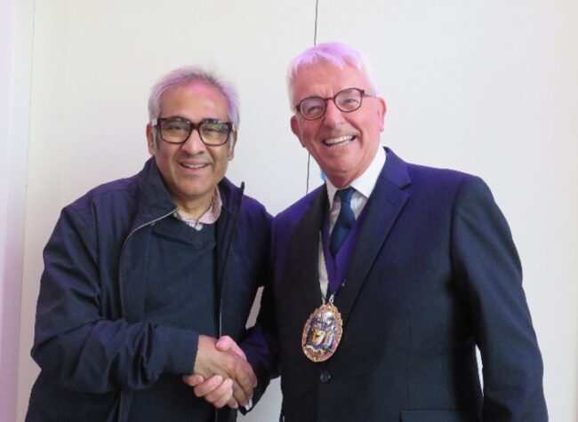 Mr. Sudhir being greeted by Simon Fordham