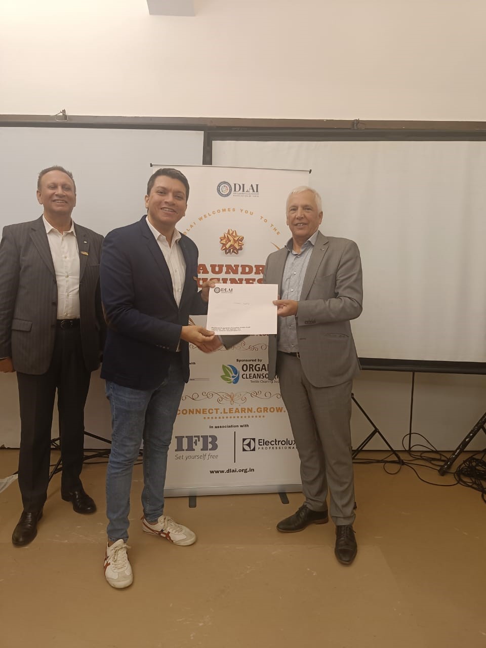 Peter-hands-over-DLAI-certificate-to-one-of-the-Masters-of-PTC-in-India